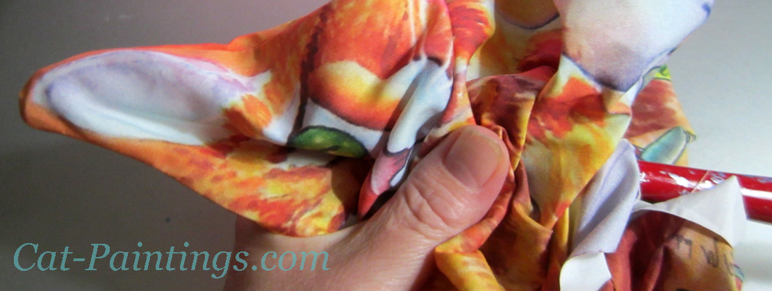 poke cat ears with dowel Rachel Armington